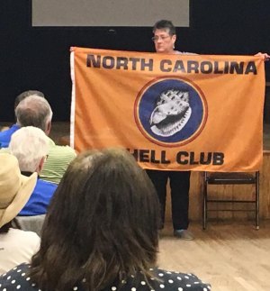 NC Shell Club president Dora Zimmerman displays the newly-purchased club flag